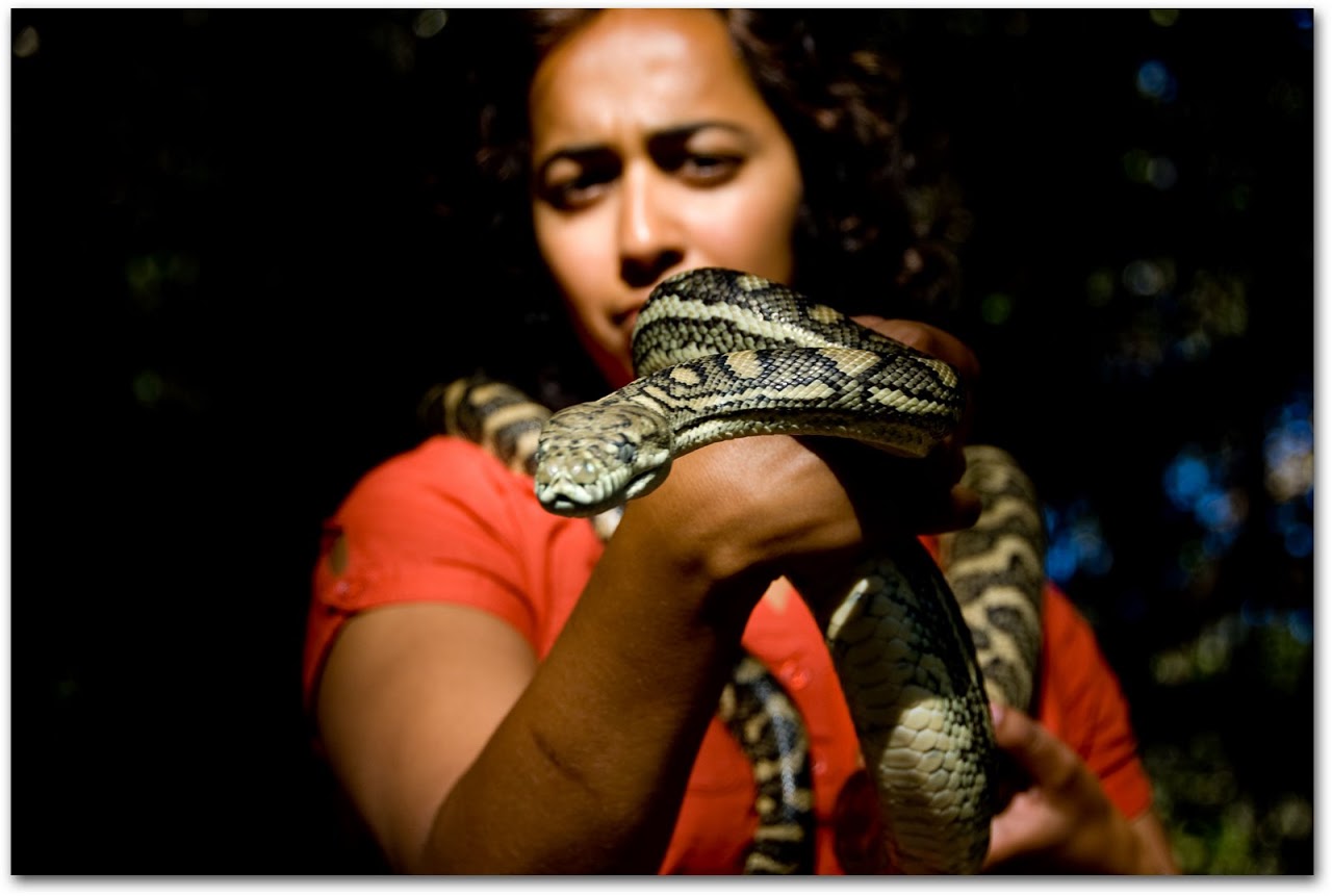 Akila holding a python