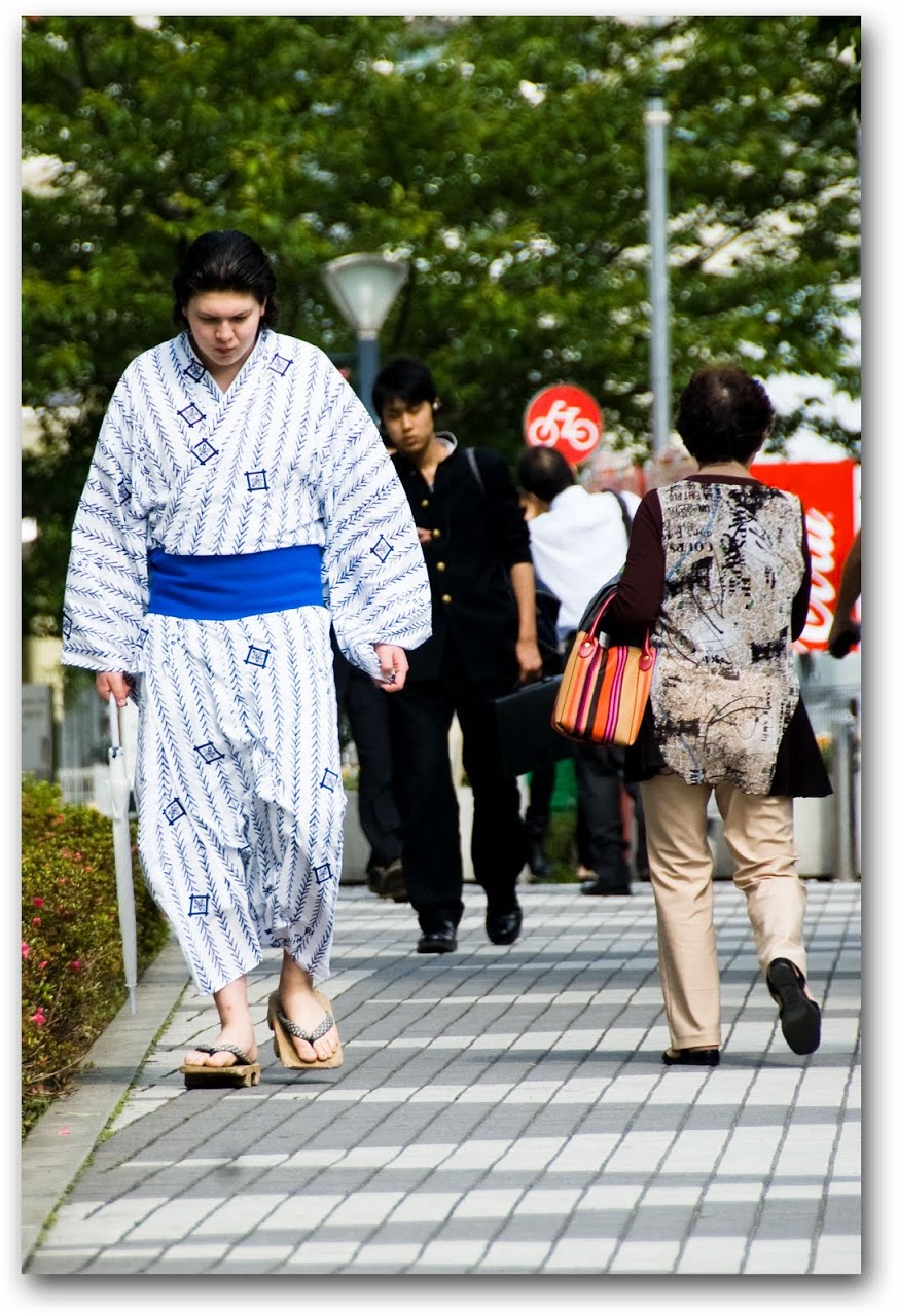 Sumo wrestler walking down street