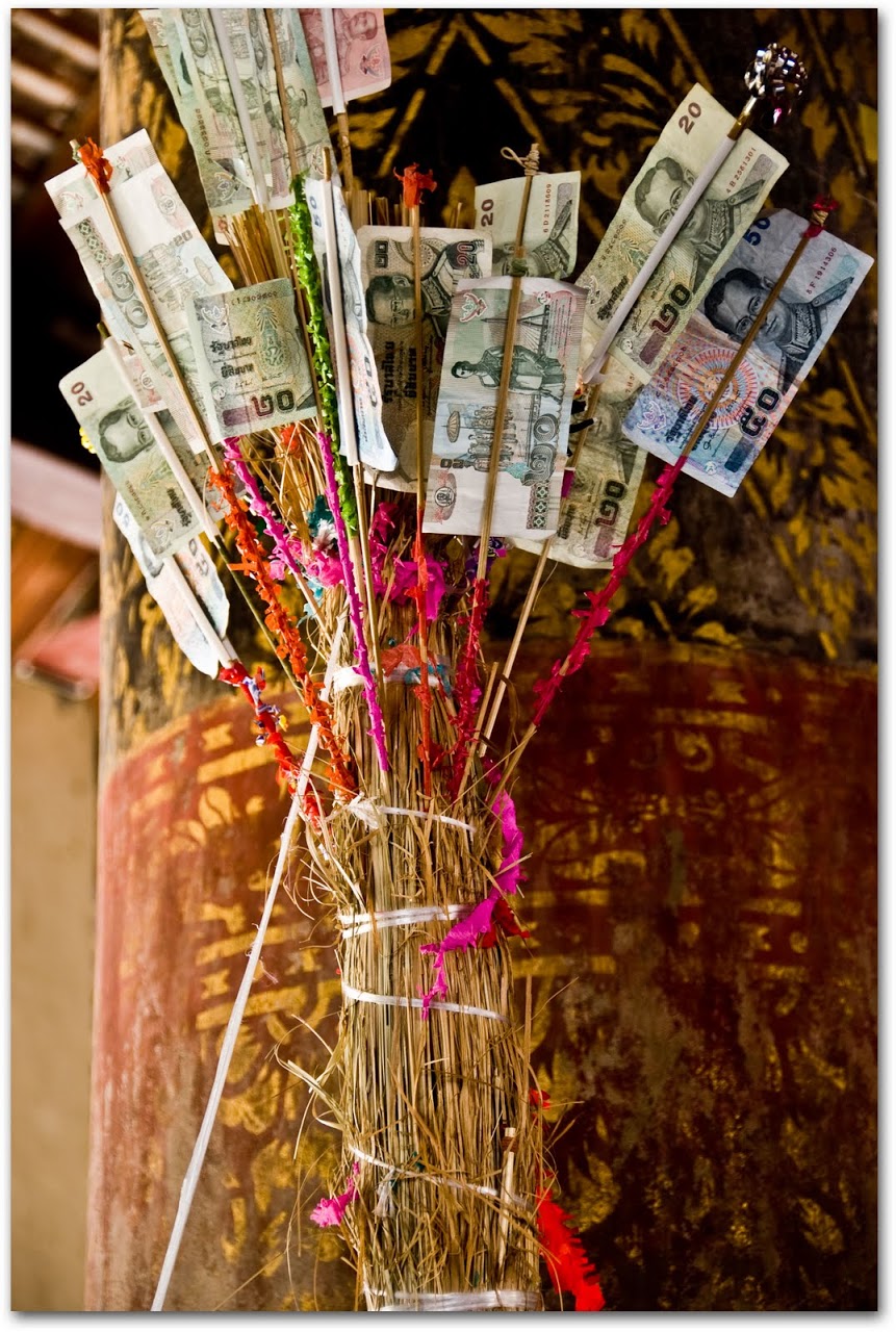 Incense with money at wat